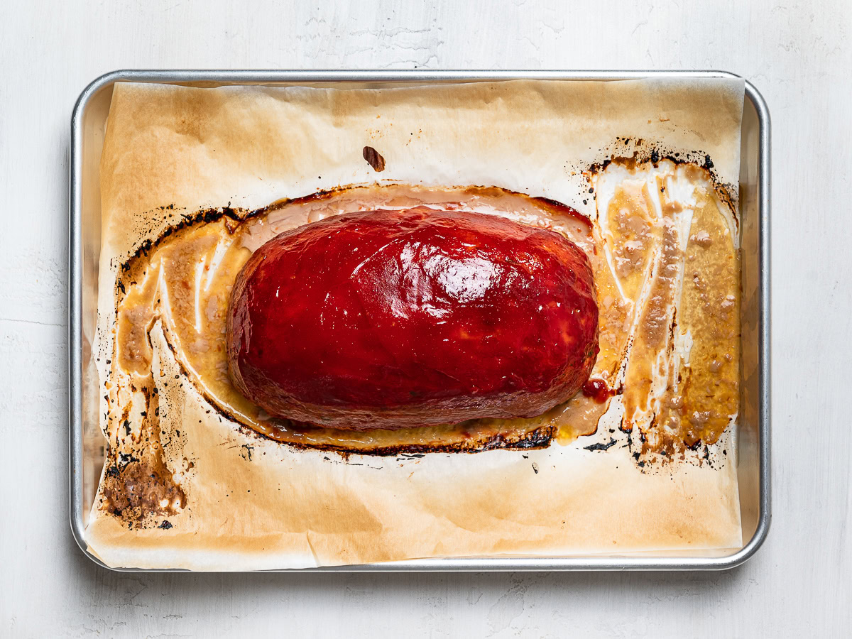 baked whole meatloaf on baking sheet