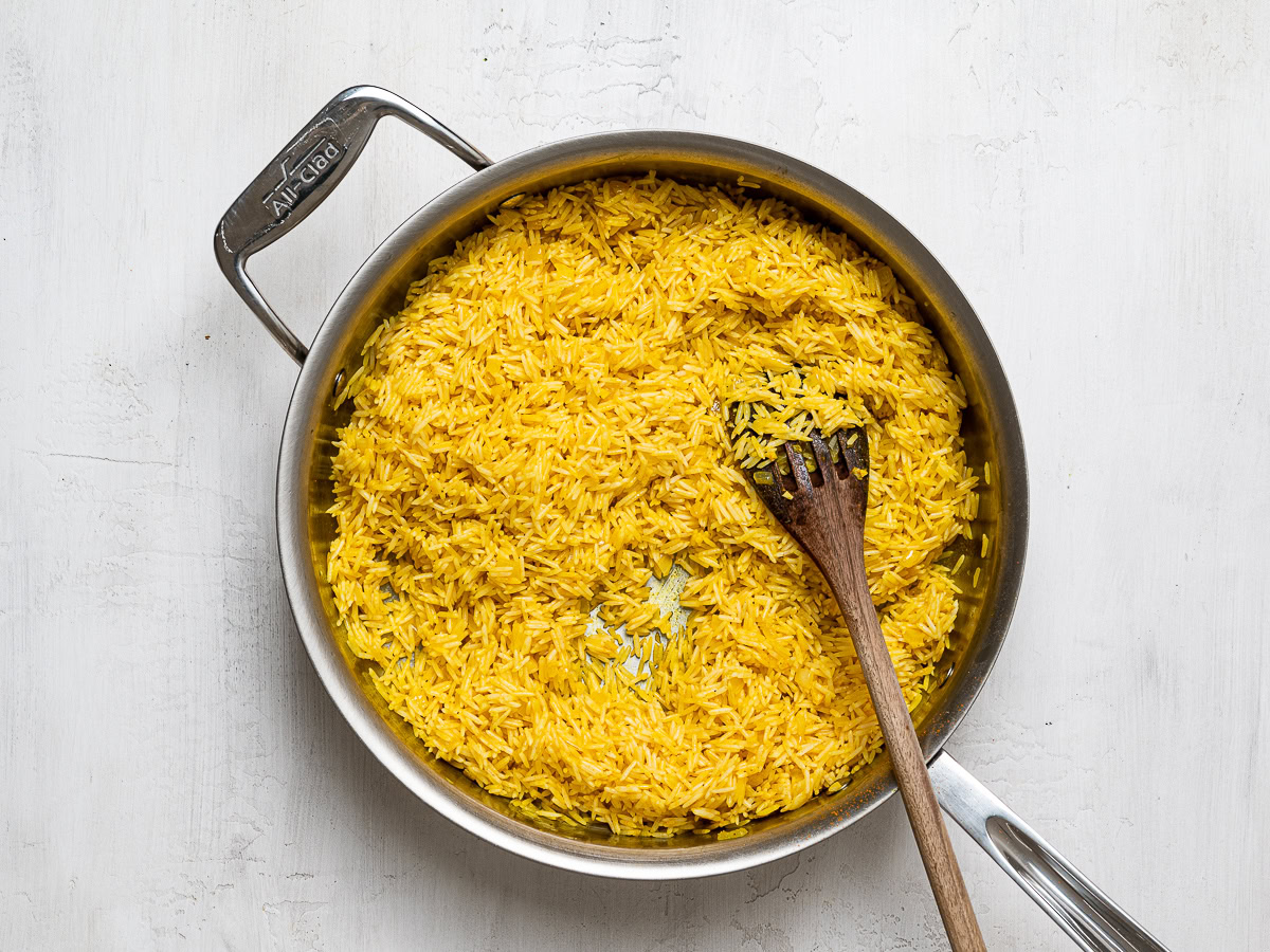 sautéing rice in oil with turmeric 