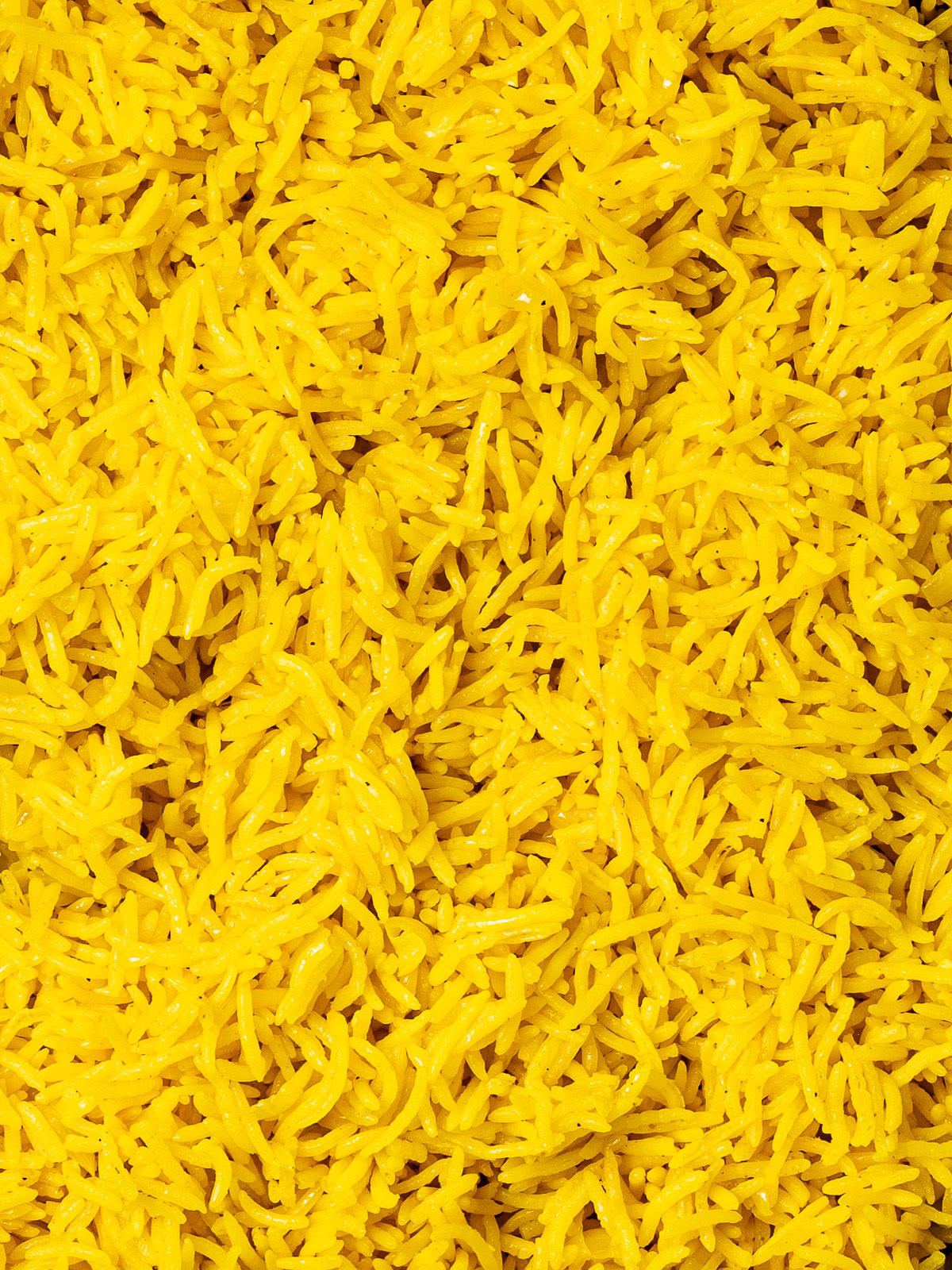 close up of just the cooked turmeric rice grains