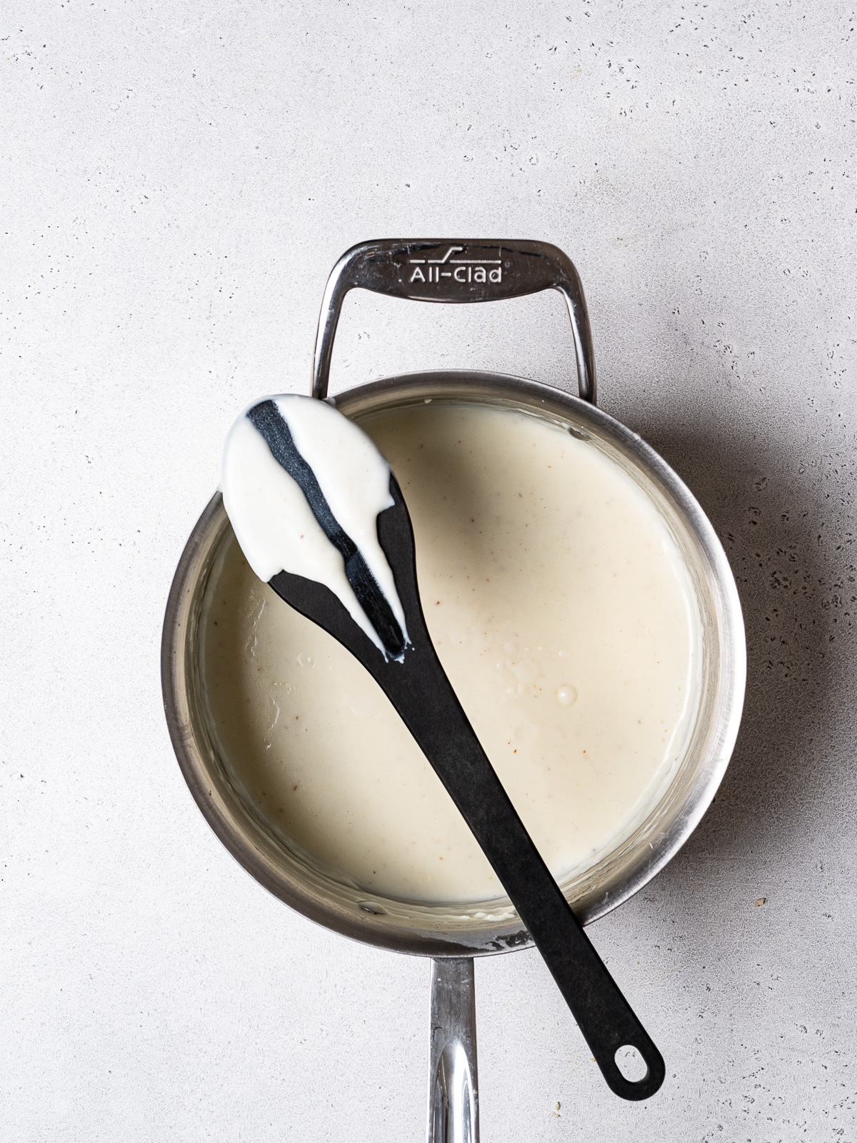 back of spoon showing thickness of béchamel sauce 