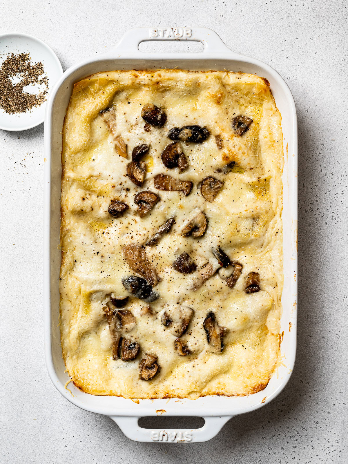 baked mushroom lasagna in baking dish