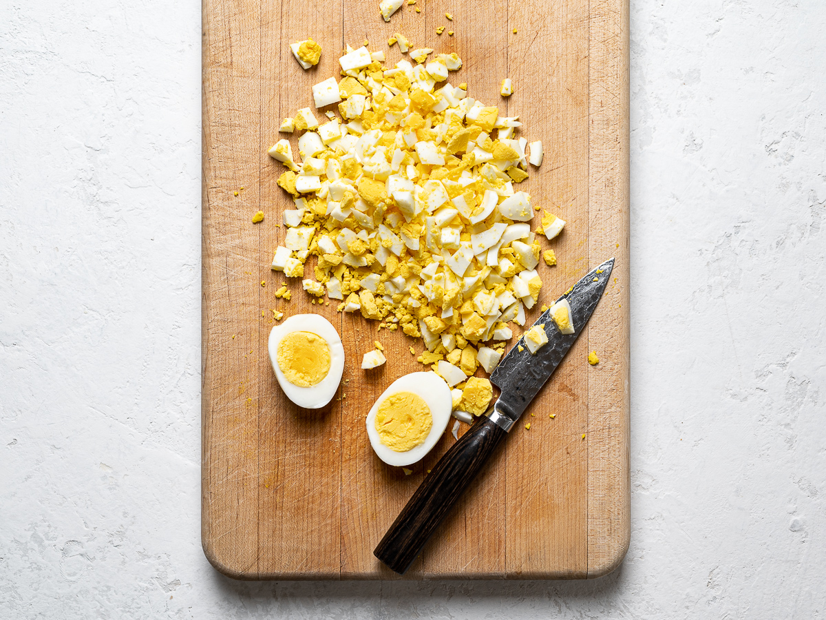 hard boiled eggs chopped on cutting board