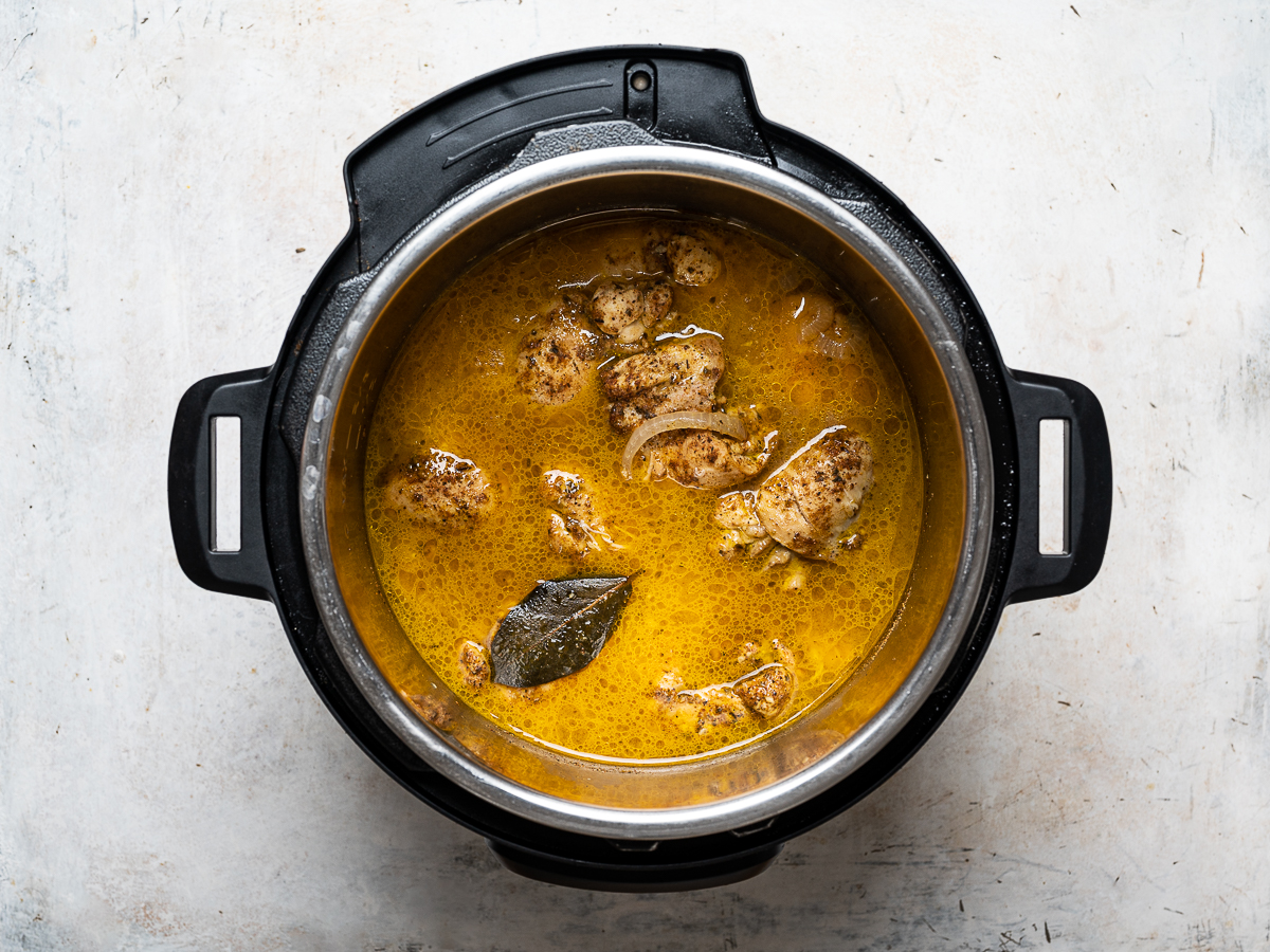 cooked chicken with juices in Instant Pot