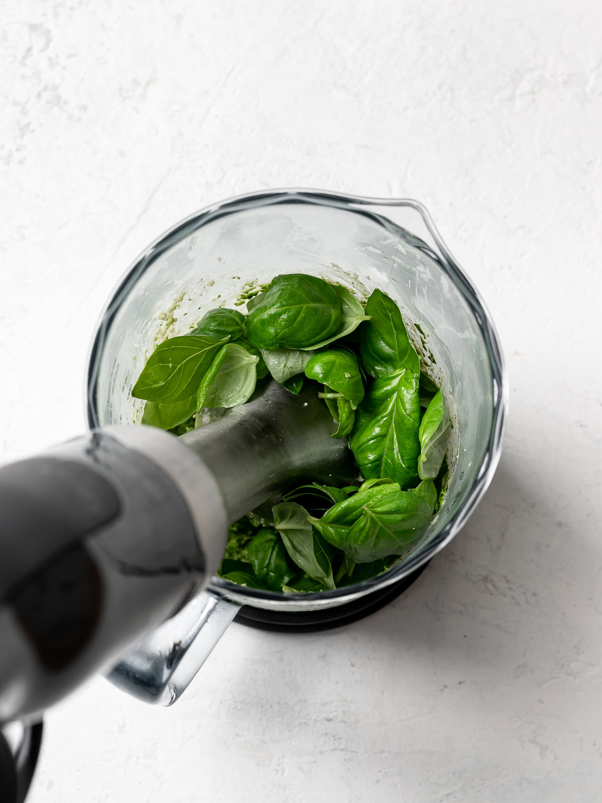 blending pesto in immersion blender