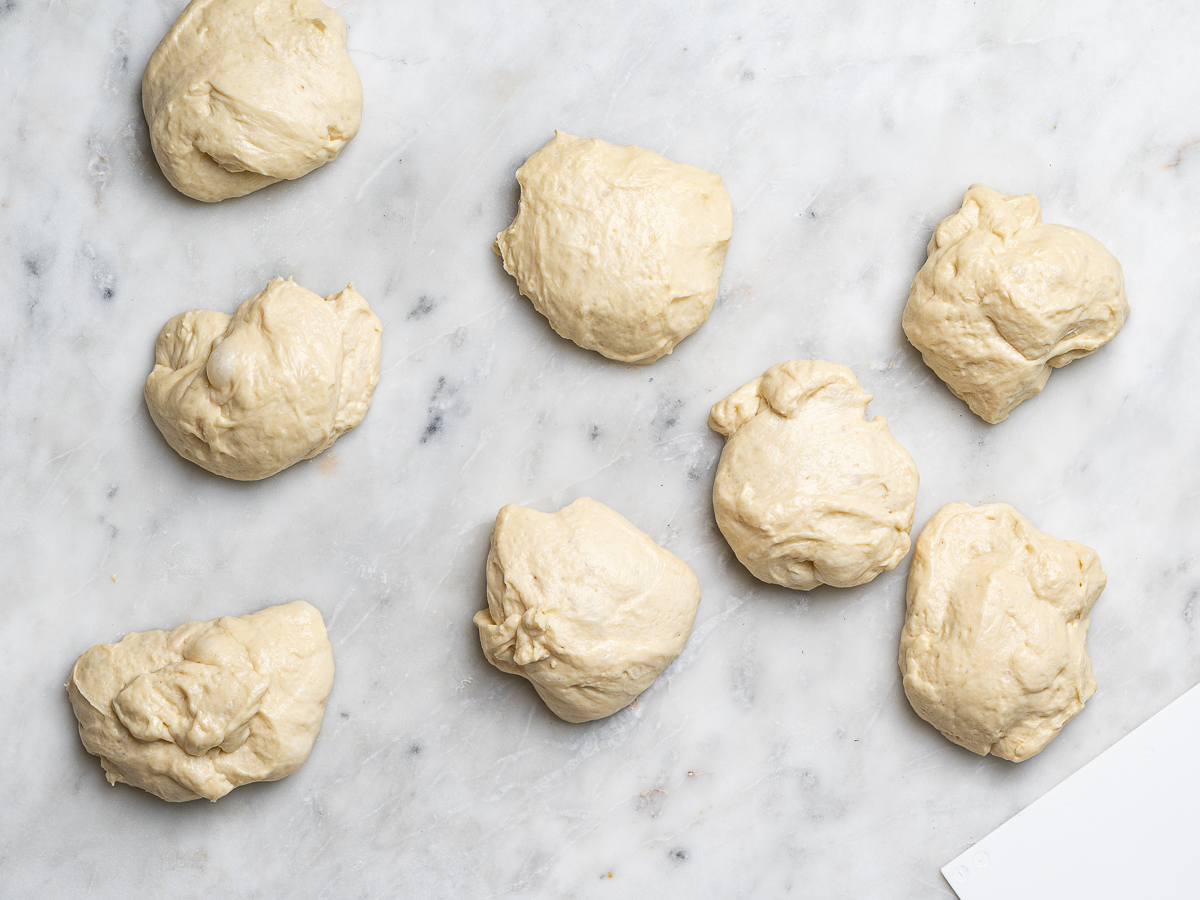 8 equal pieces of dough on counter