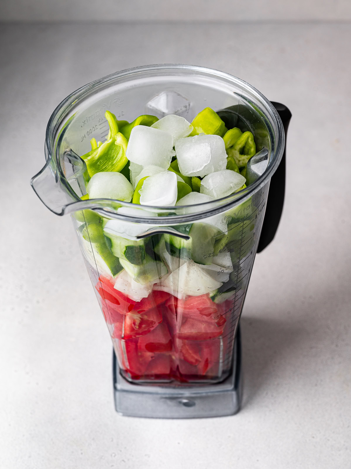 unblended gazpacho ingredients in blender jar