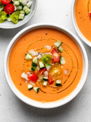 Gazpacho in bowls topped with garnishes