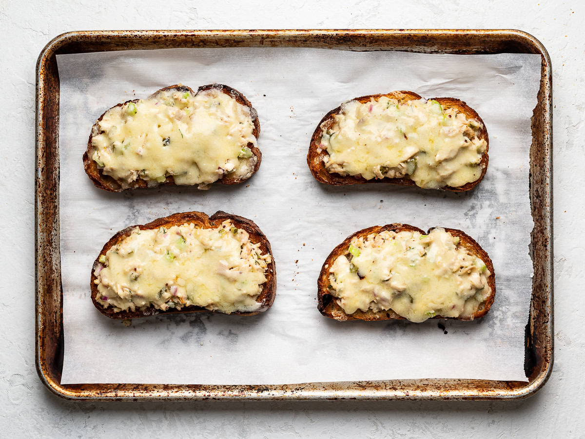 4 open-faced tuna melts on baking sheet