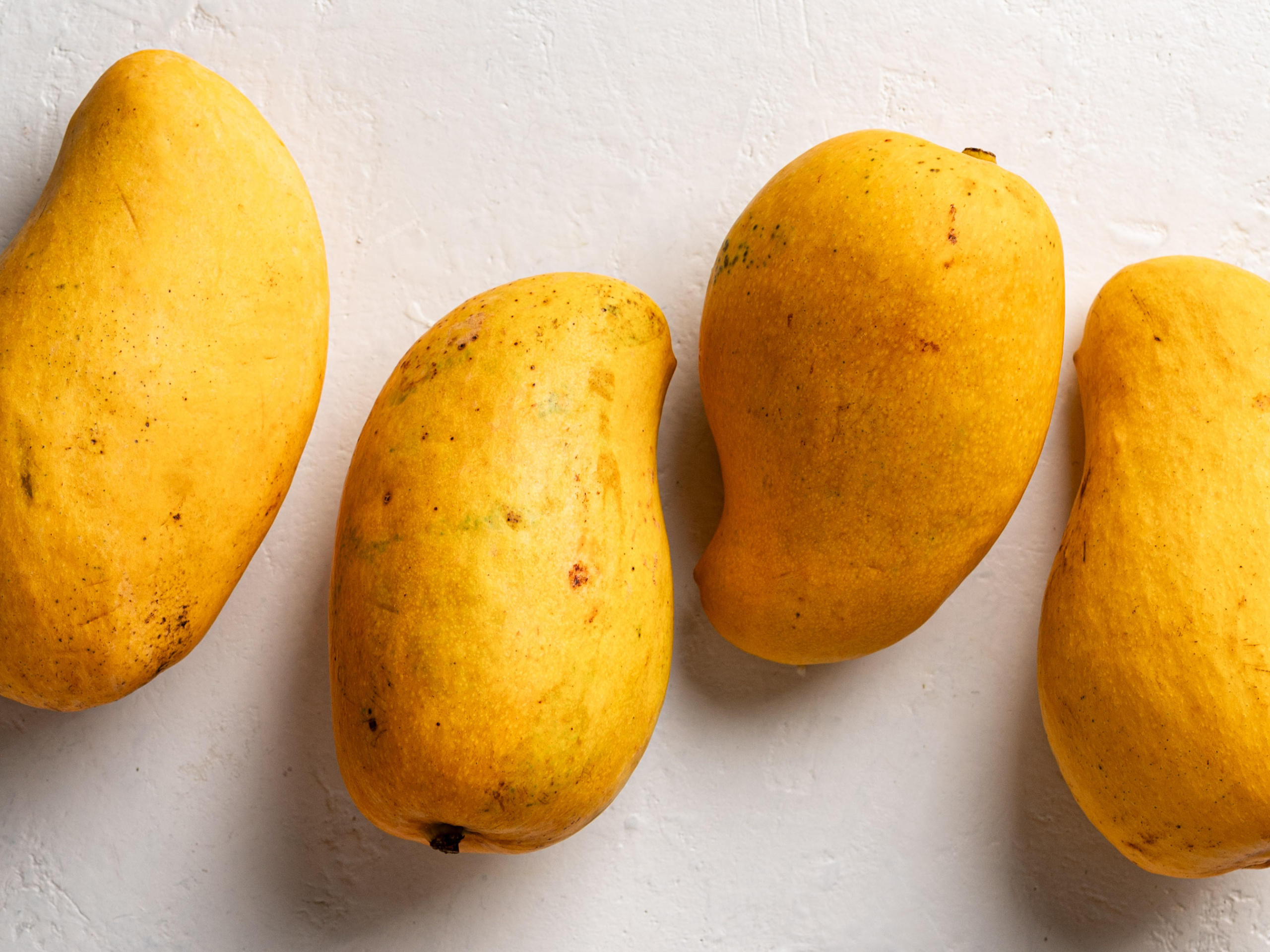4 Ataulfo mangoes lined up