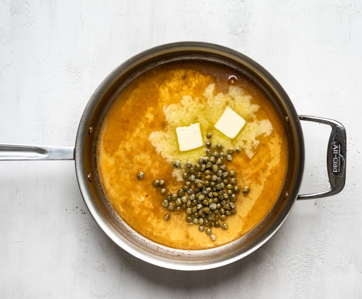 making the butter lemon caper sauce in the skillet