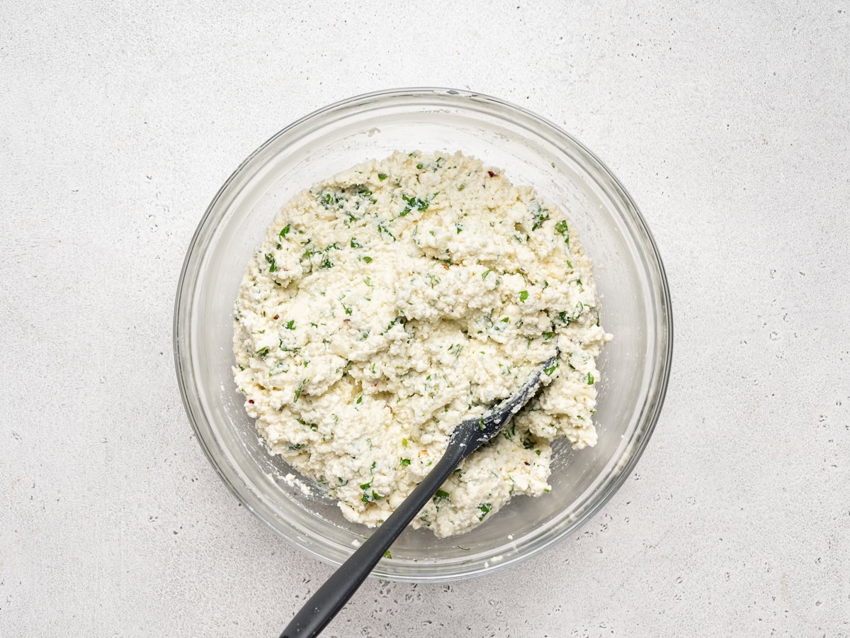 whisked ricotta mixture in bowl