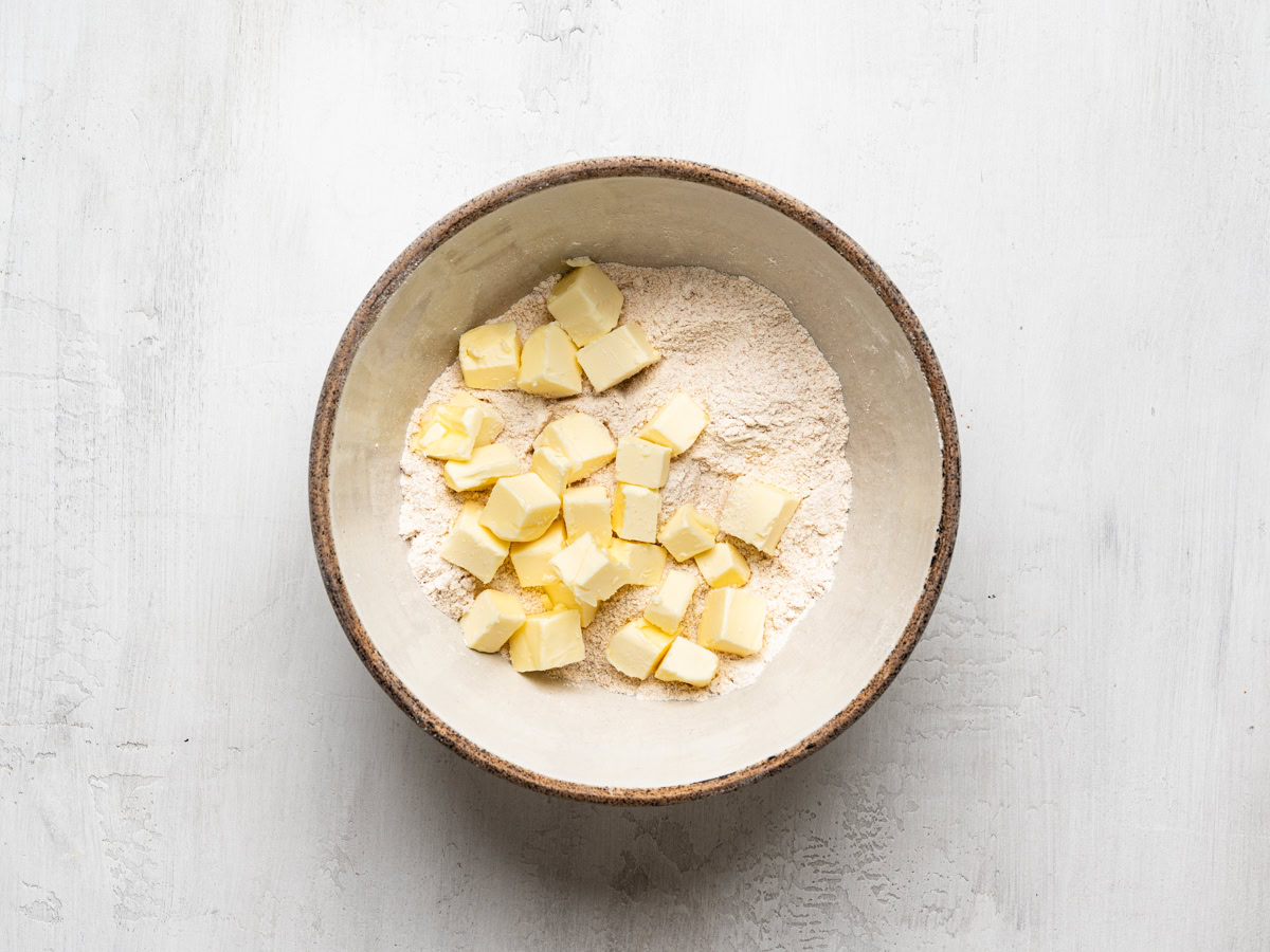 diced butter in bowl with topping ingredients