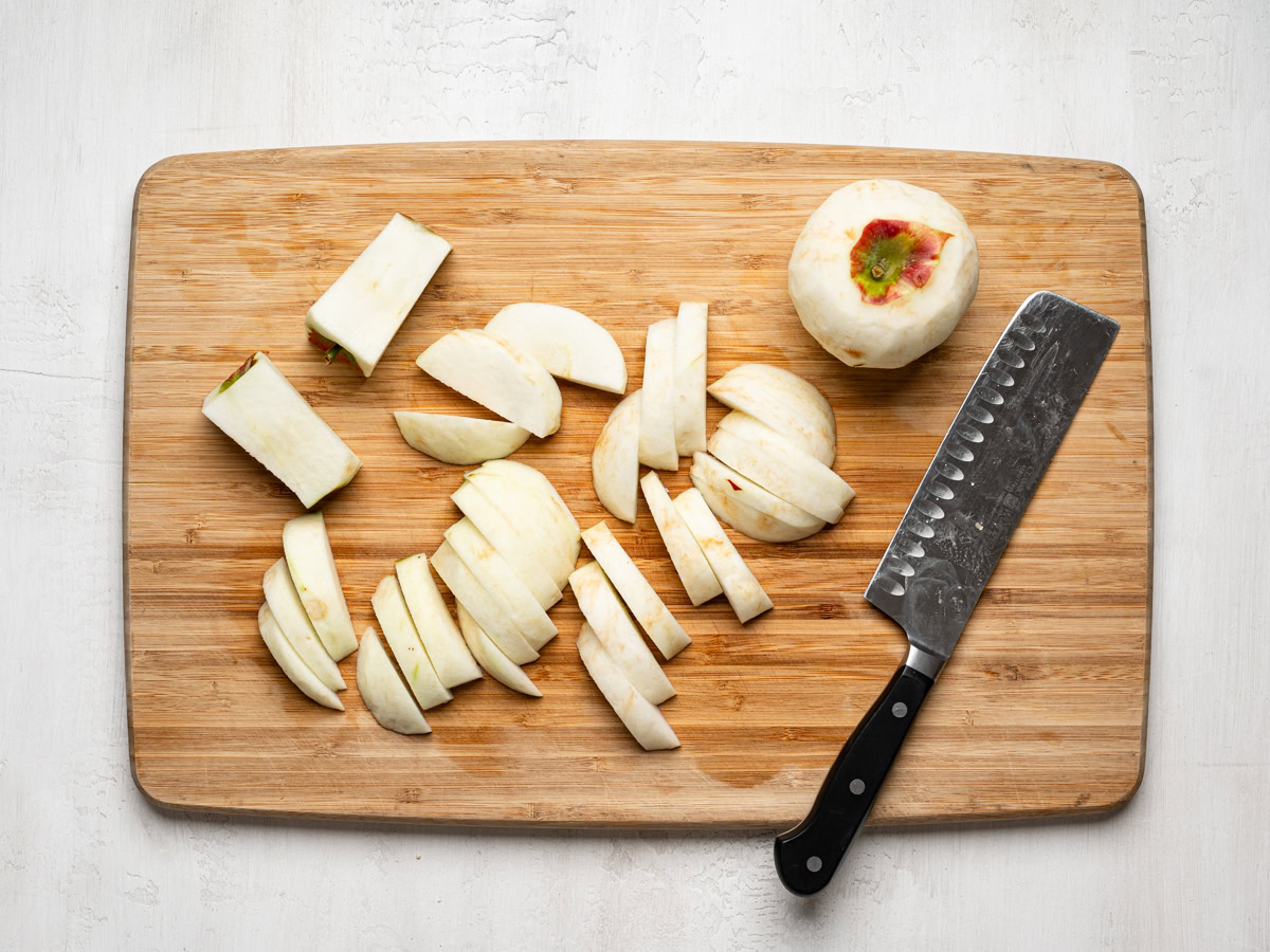 apples cut into slices on a cutting board