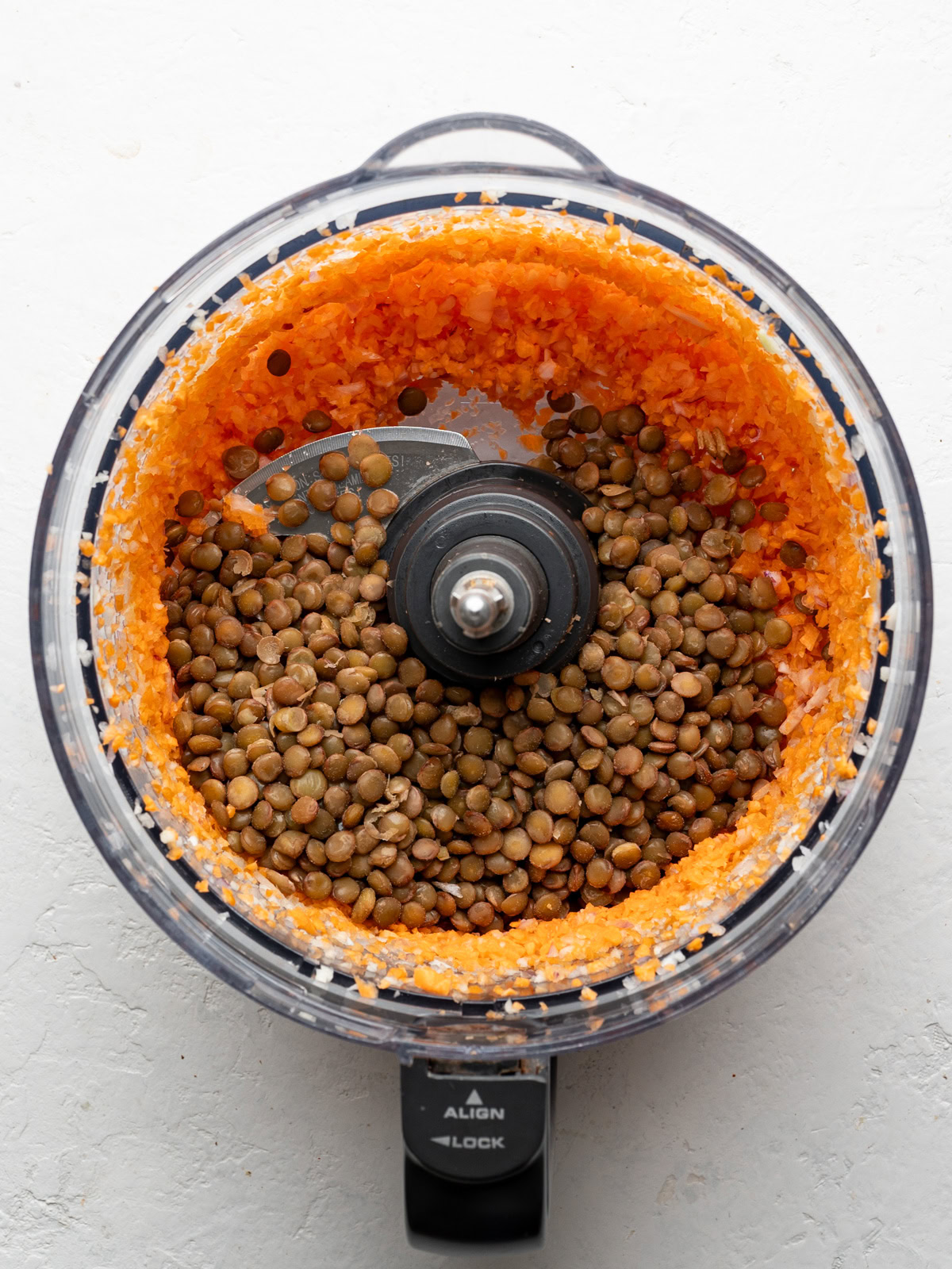 cooked lentils added to carrot-onion mixture in food processor