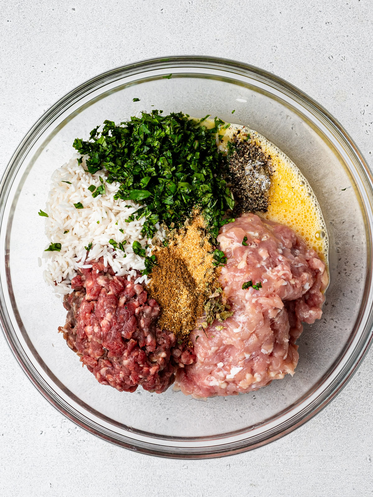meatball ingredients in a glass bowl