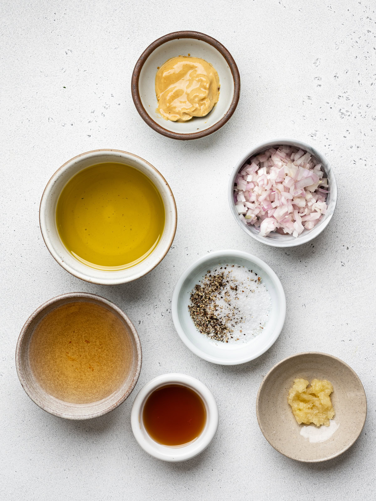 ingredients for dressing in small bowls