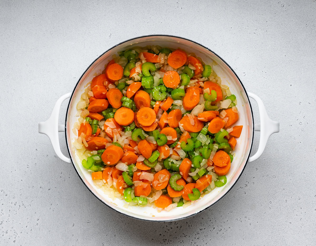 Chopped carrots, onions, and celery sautรฉed in white pot