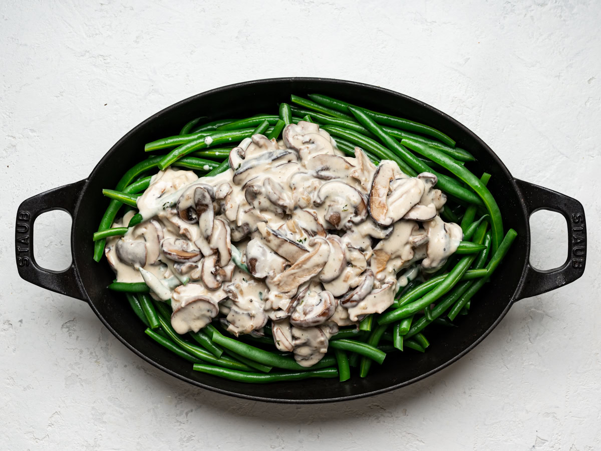 creamy mushroom sauce layered over green beans in casserole