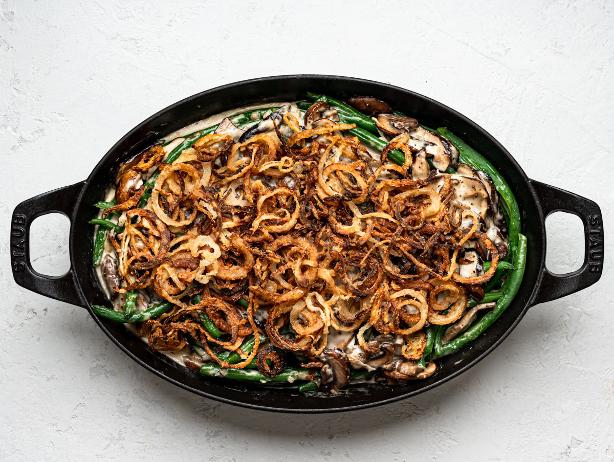 baked green bean casserole in oval black baking dish