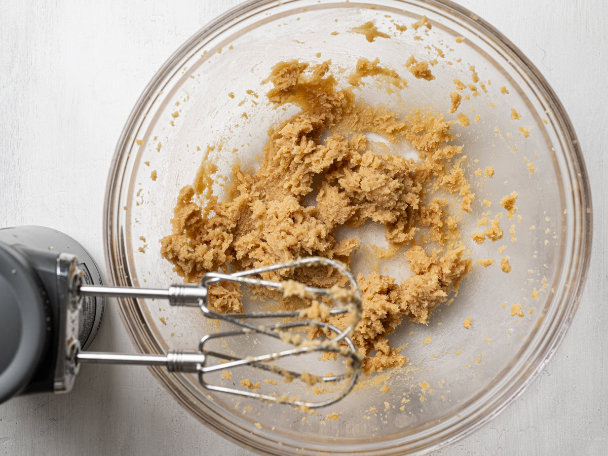 beaten butter and sugar in glass bowl