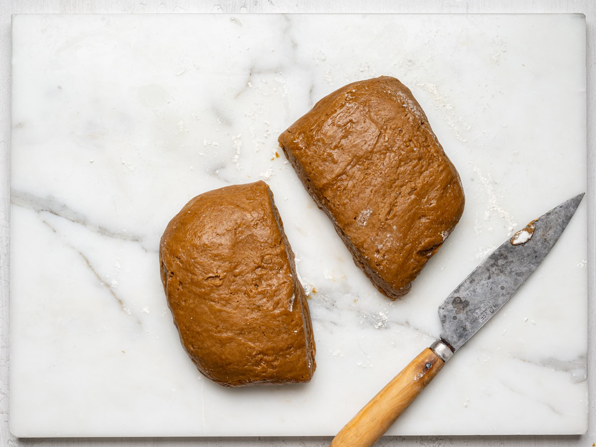 dough cut in half with knife on the side 