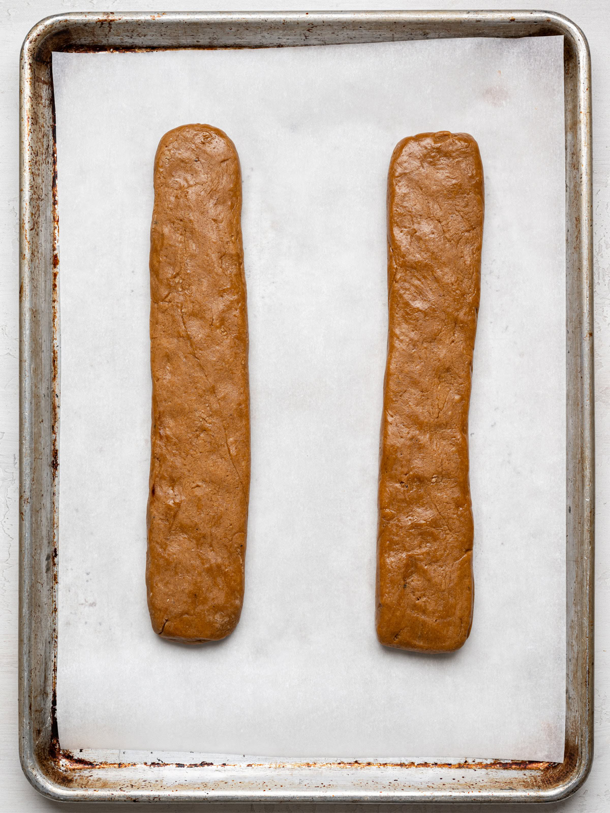 dough shaped into two logs on baking sheet