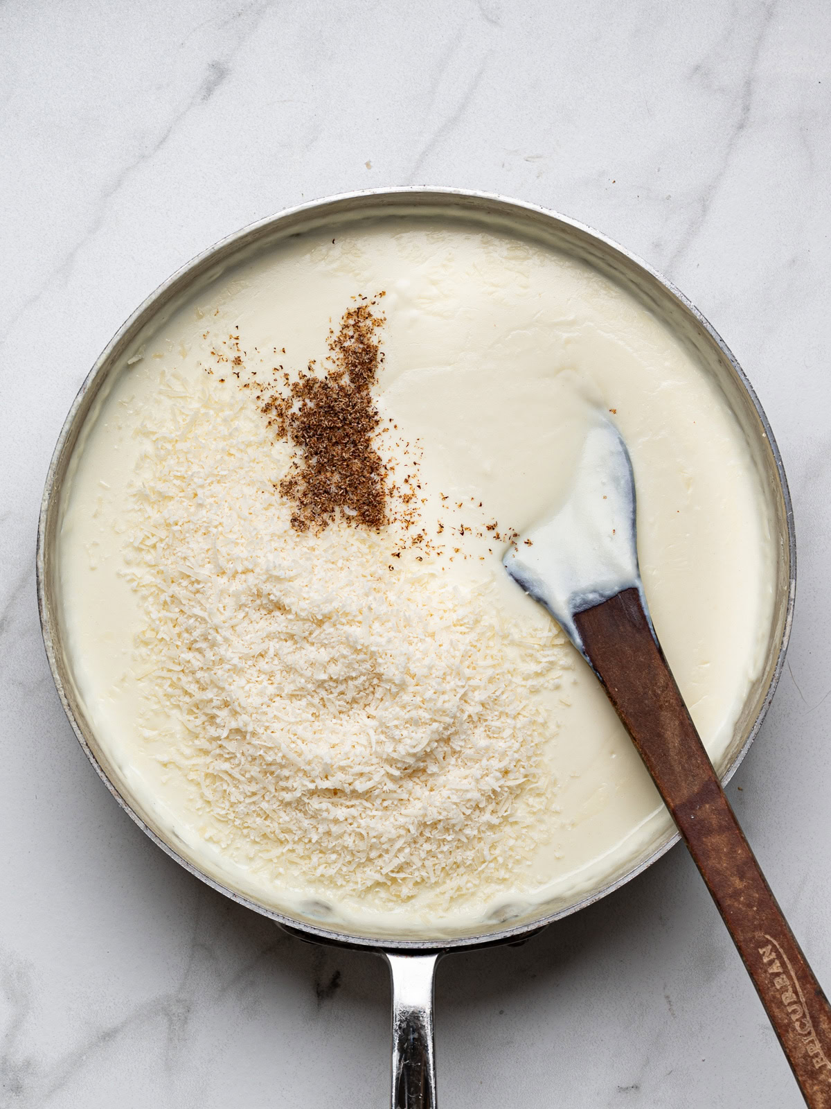 adding parmesan and nutmeg to bechamel sauce 