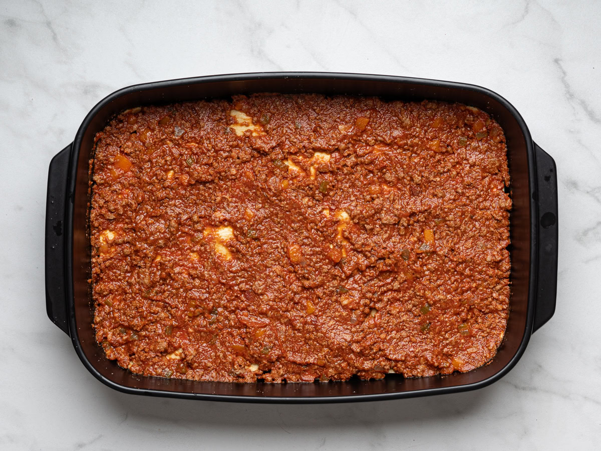 layer of bolognese sauce over lasagna sheets