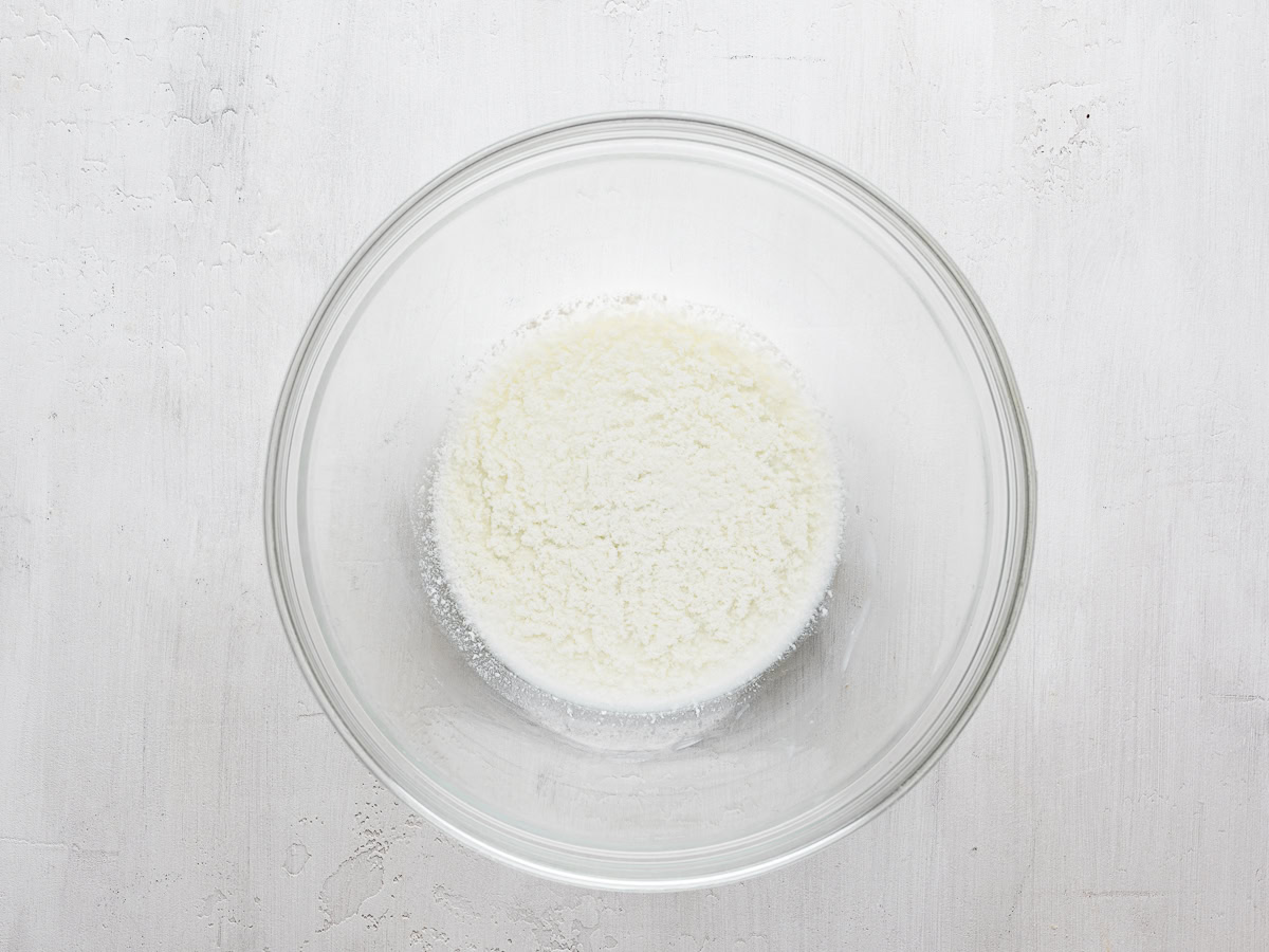 milk with vinegar in glass mixing bowl