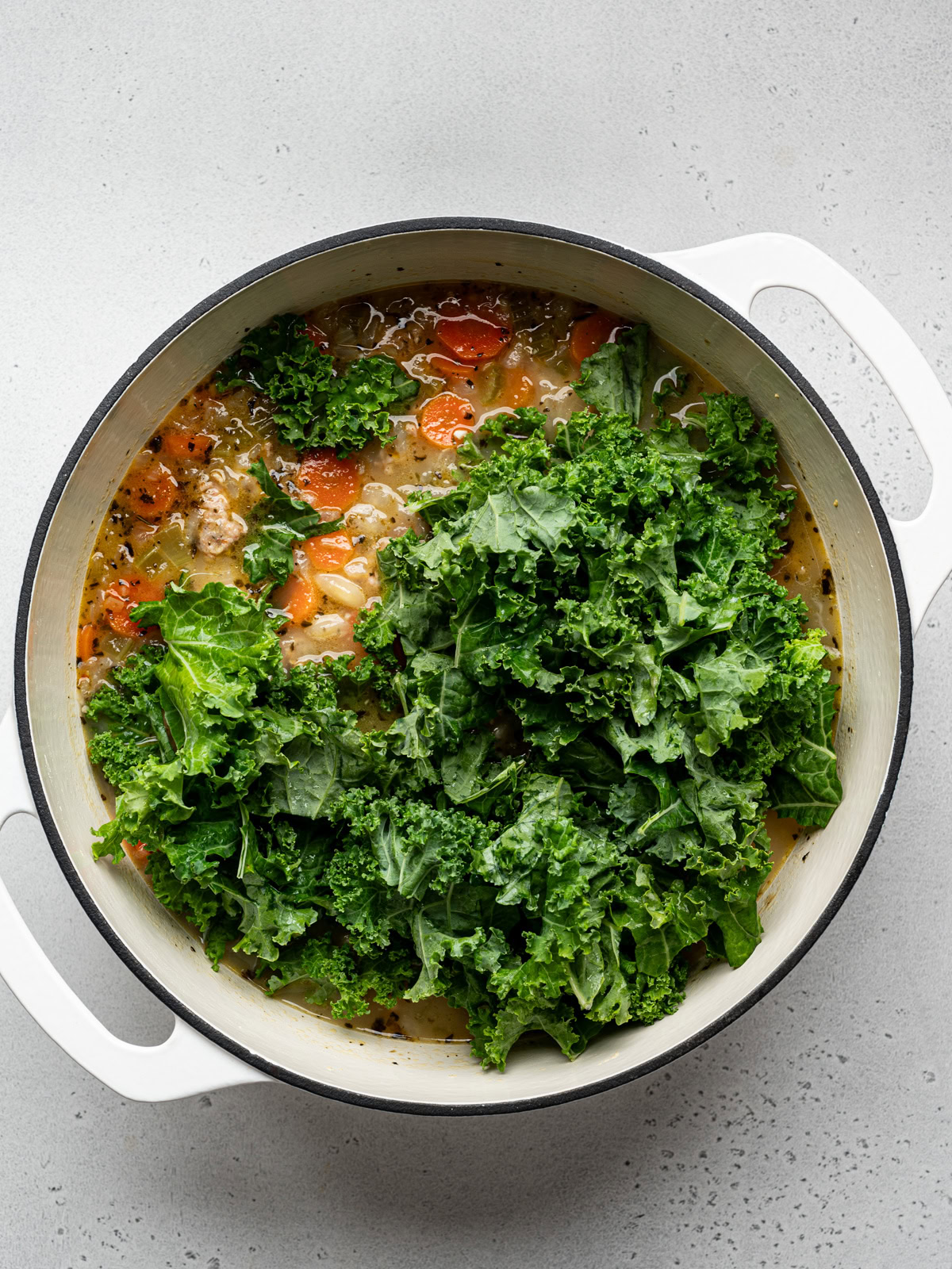 kale added to soup pot