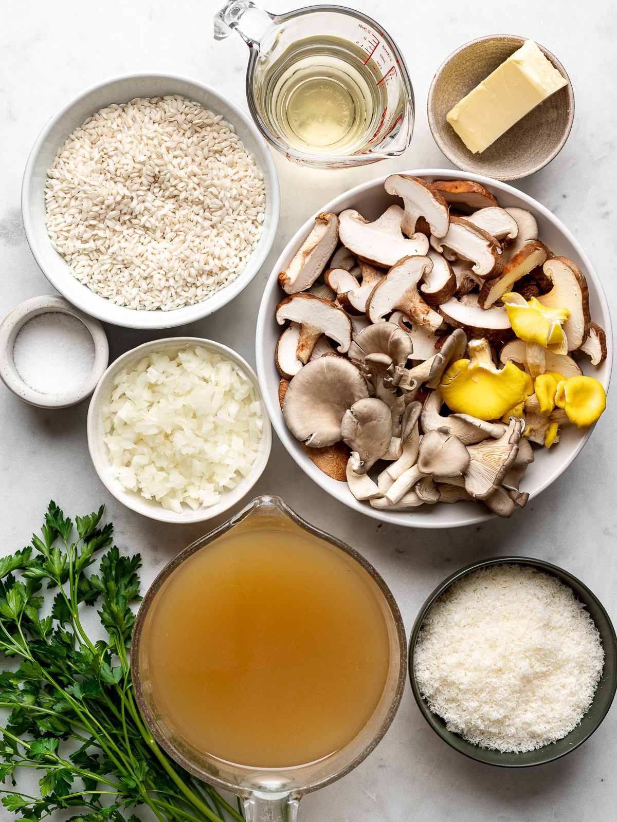 recipe ingredients for mushroom risotto prepared in small bowls