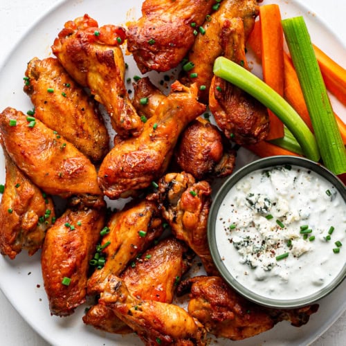 closeup of baked chicken wings on platter