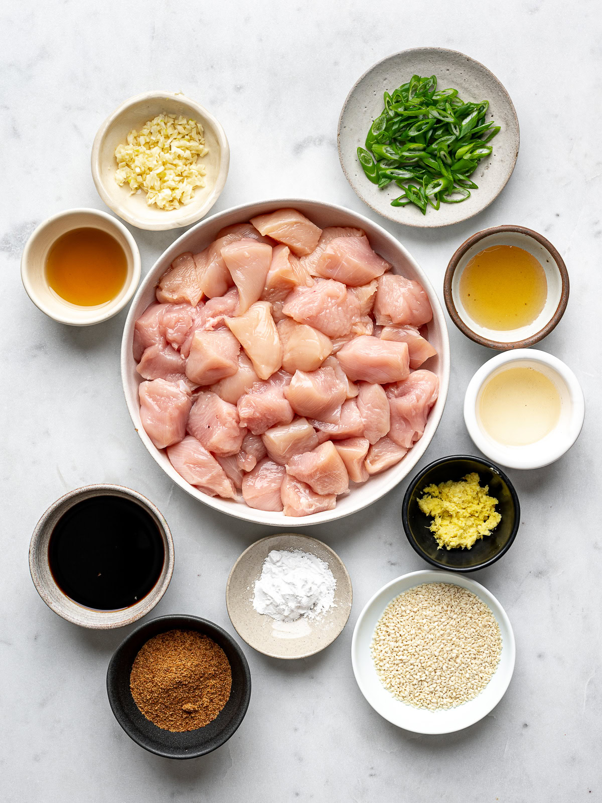 Recipe ingredients prepared in bowls.