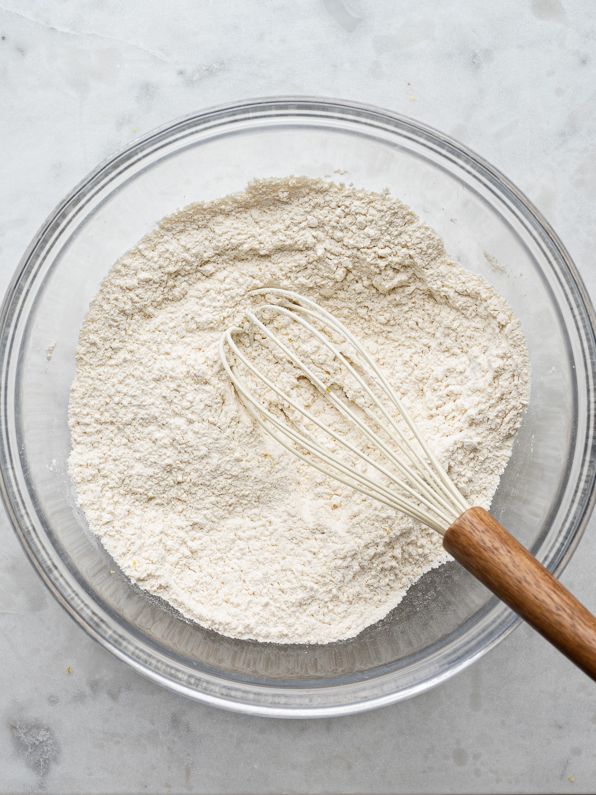 flour and other dry ingredients added to the sugar in the mixing bowl.