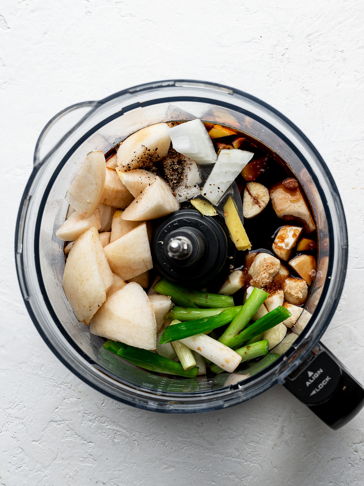 Marinade blended in bowl of a food processor.
