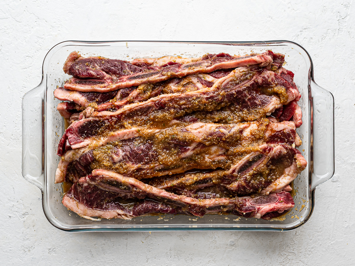 Flanken-cut short ribs marinating in glass baking dish. 