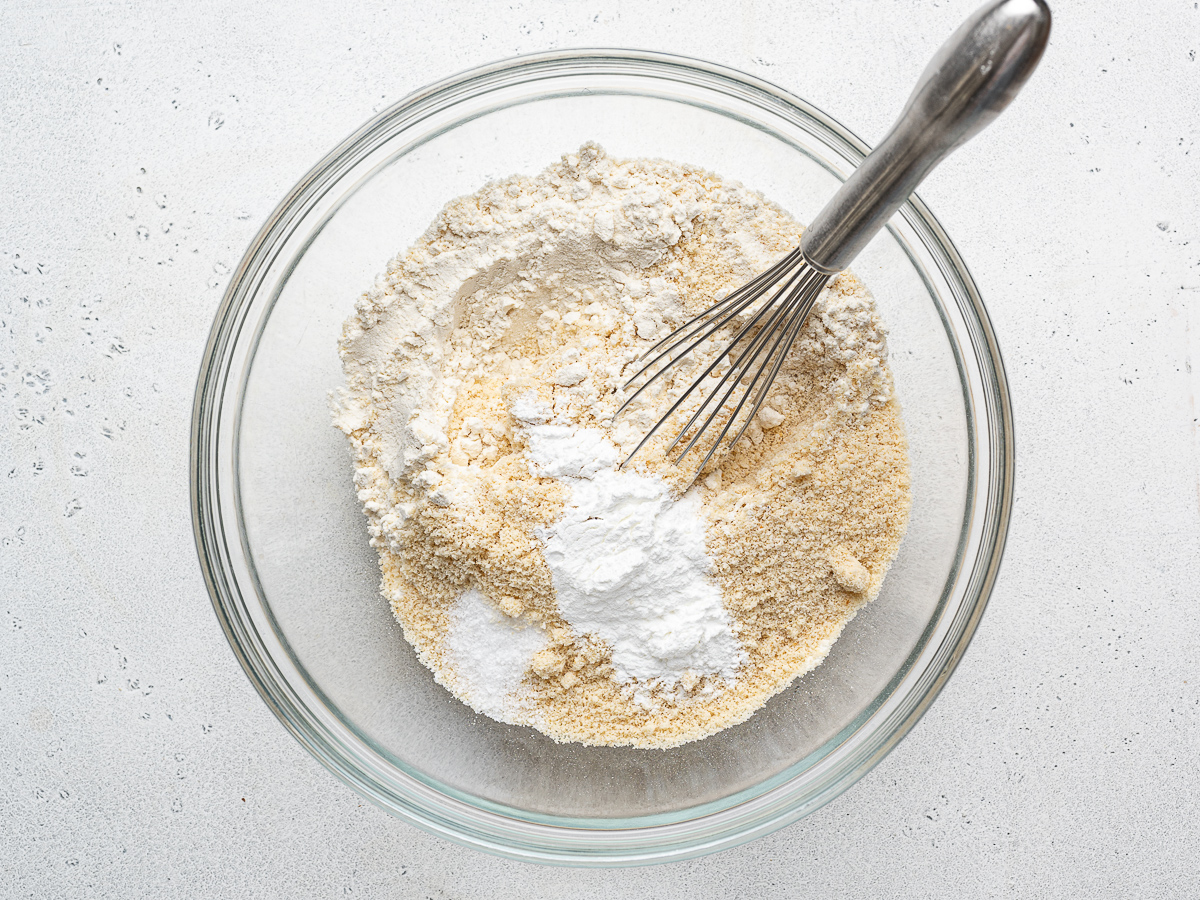 Mixing dry ingredients in a glass mixing bowl. 