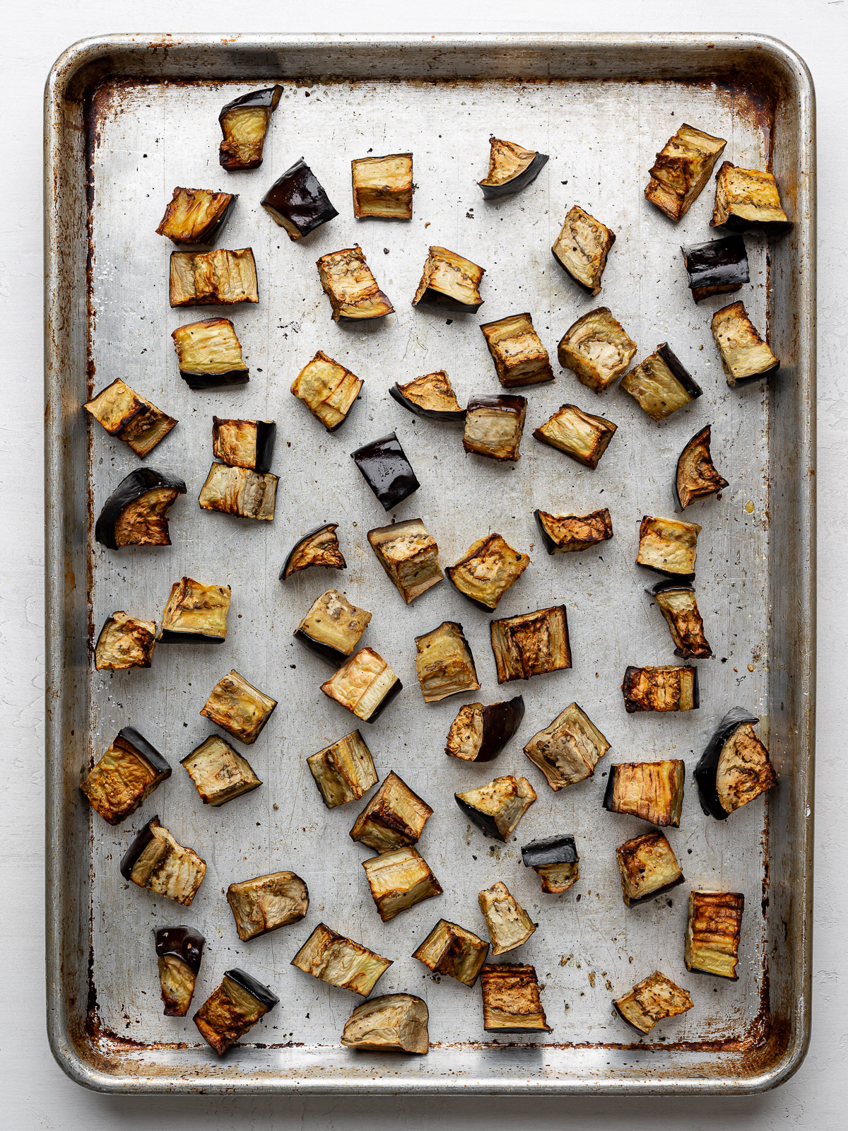 Roasted eggplant on sheet pan.