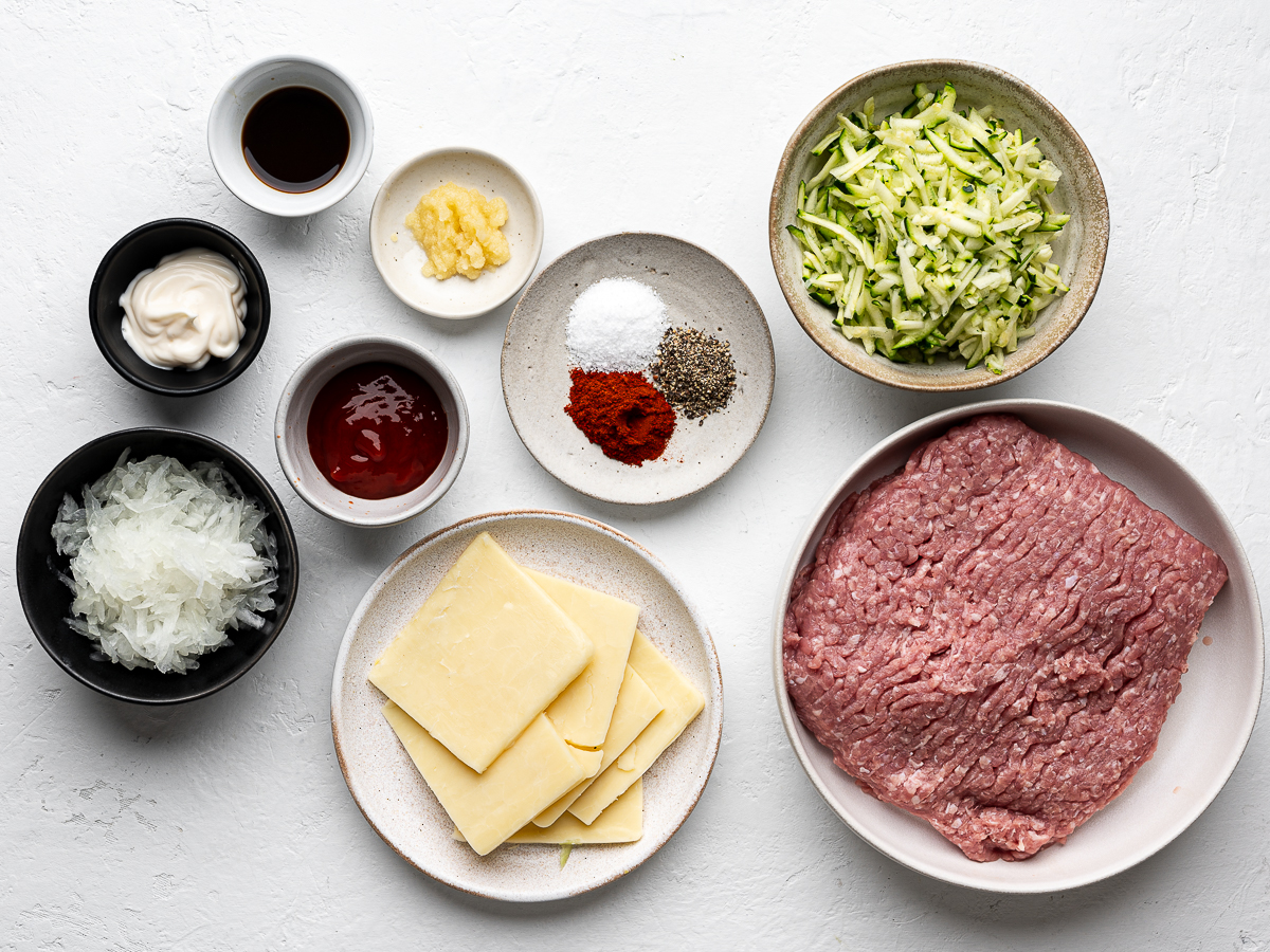 Ingredients for the  burger patties prepared in bowls. 