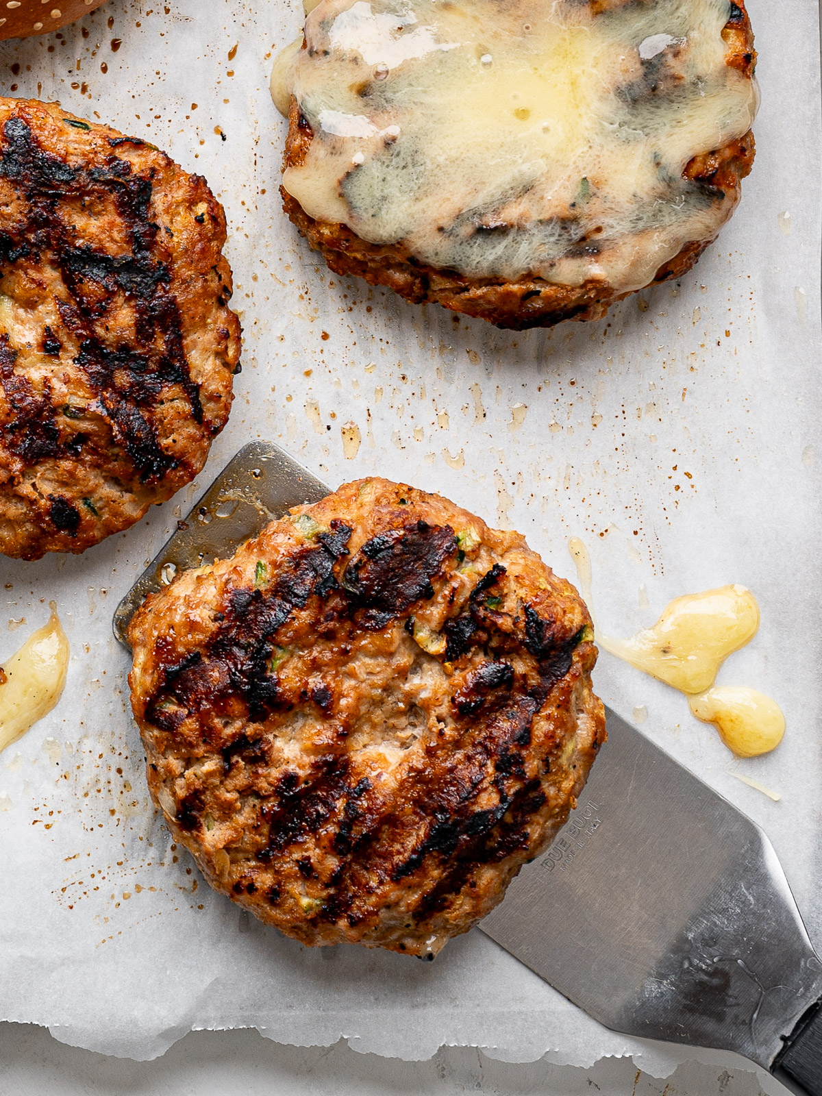 Close up of grilled turkey zucchini patty.