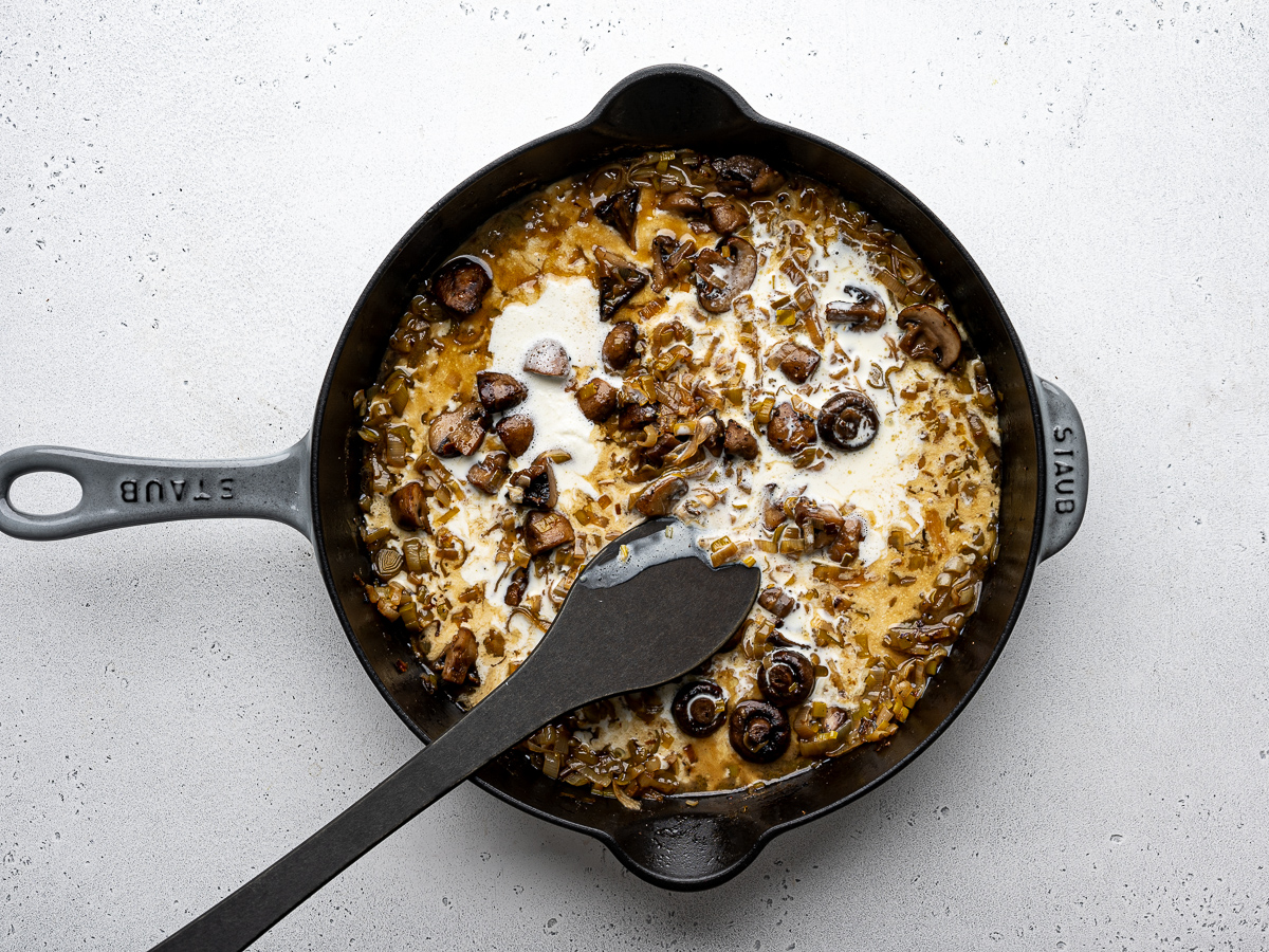 Heavy cream added to skillet.