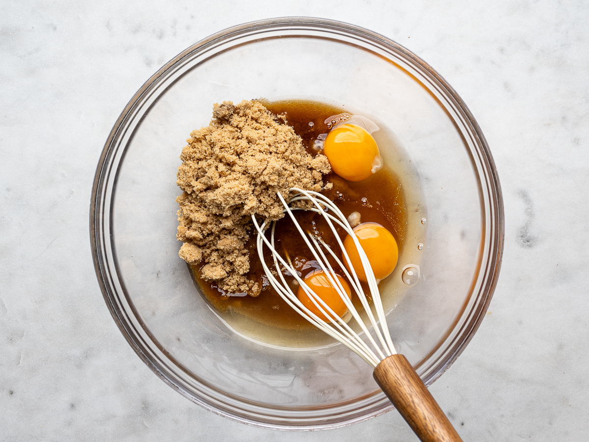 Eggs and sugar in glass bowl about to be beaten. 