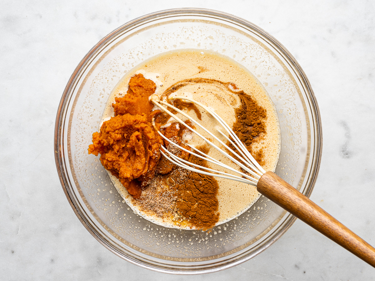 Pumpkin puree and spices added to bowl with egg mixture. 