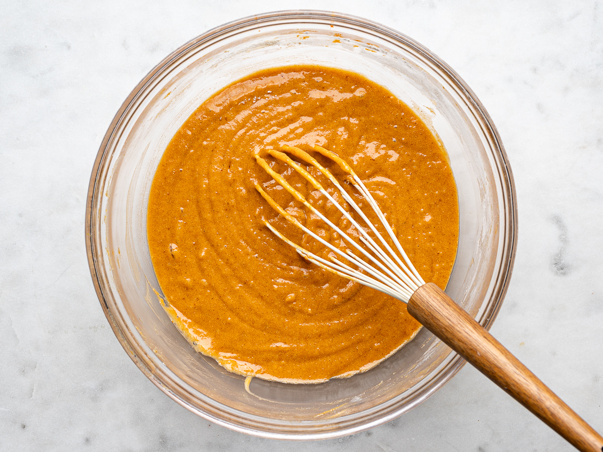 Mixed batter in glass mixing bowl. 