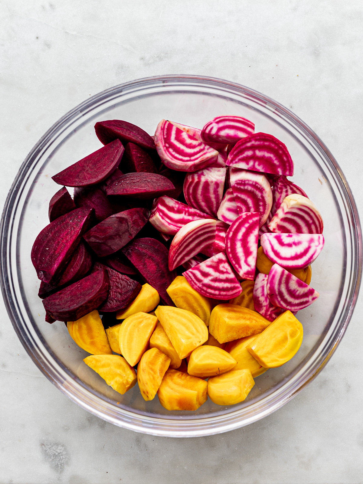 Sliced beets in mixing bowl. 