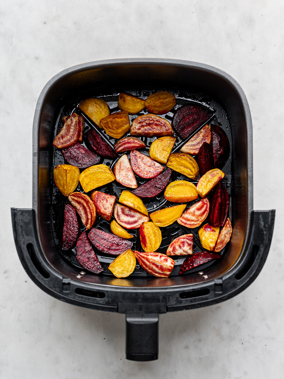 Roasted beets in air fryer basket. 