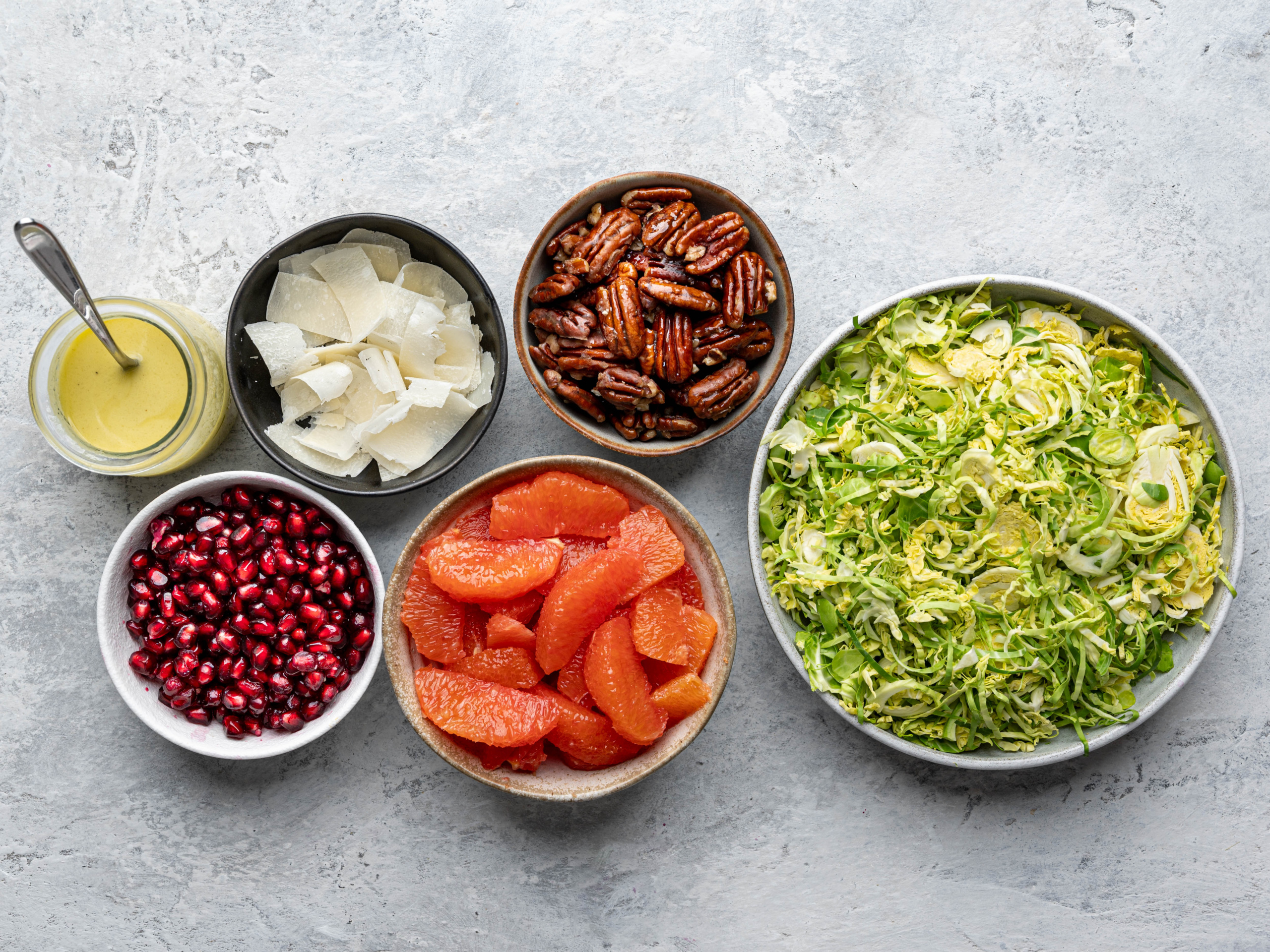 Recipe ingredients prepared in individual bowls.