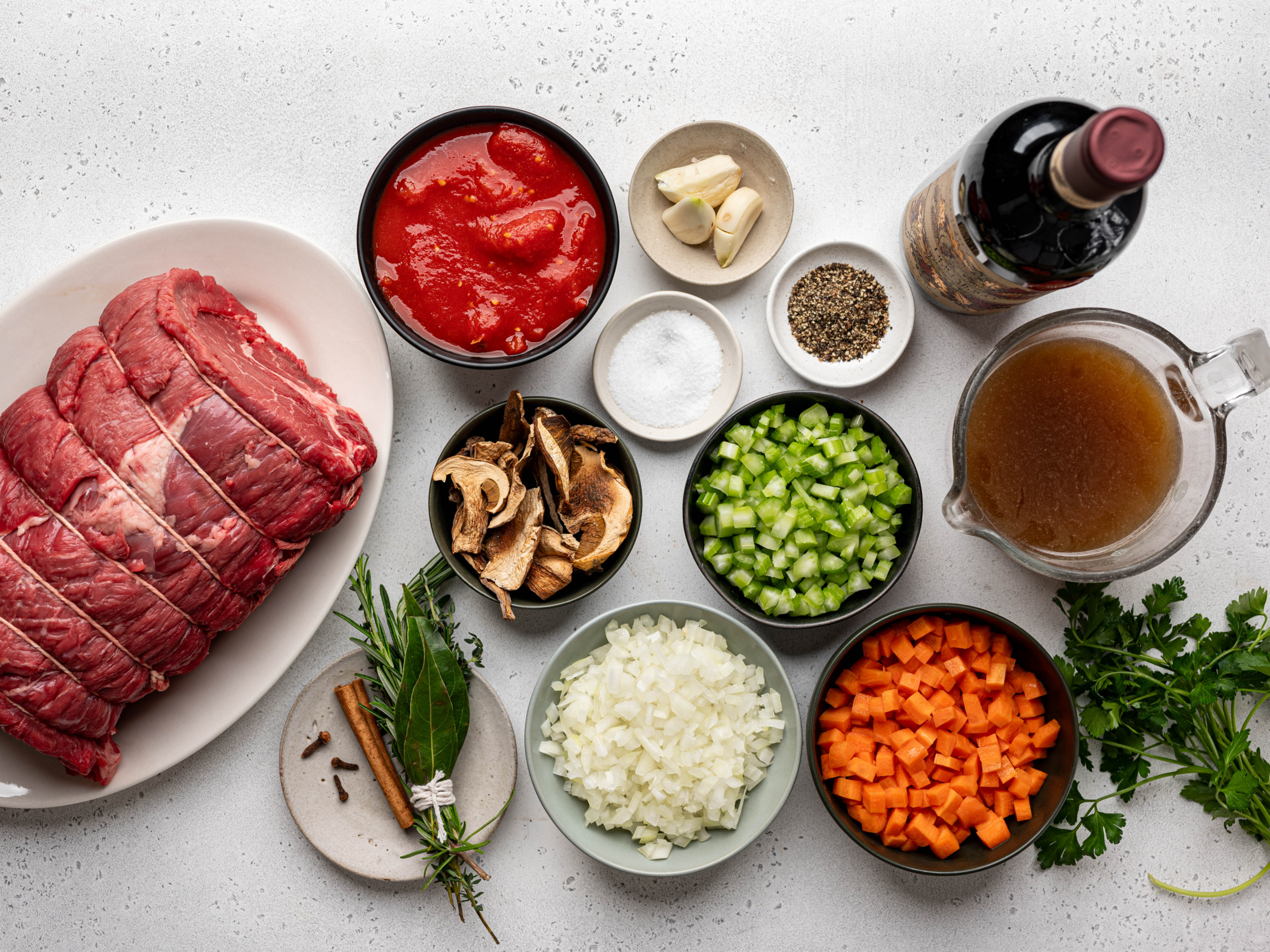 Recipe ingredients prepared in individual bowls.