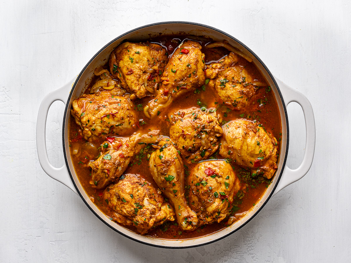 Chicken pieces cooked half-way through.