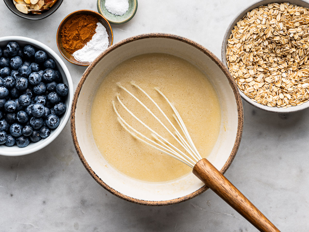Wet ingredients whisked in mixing bowl.